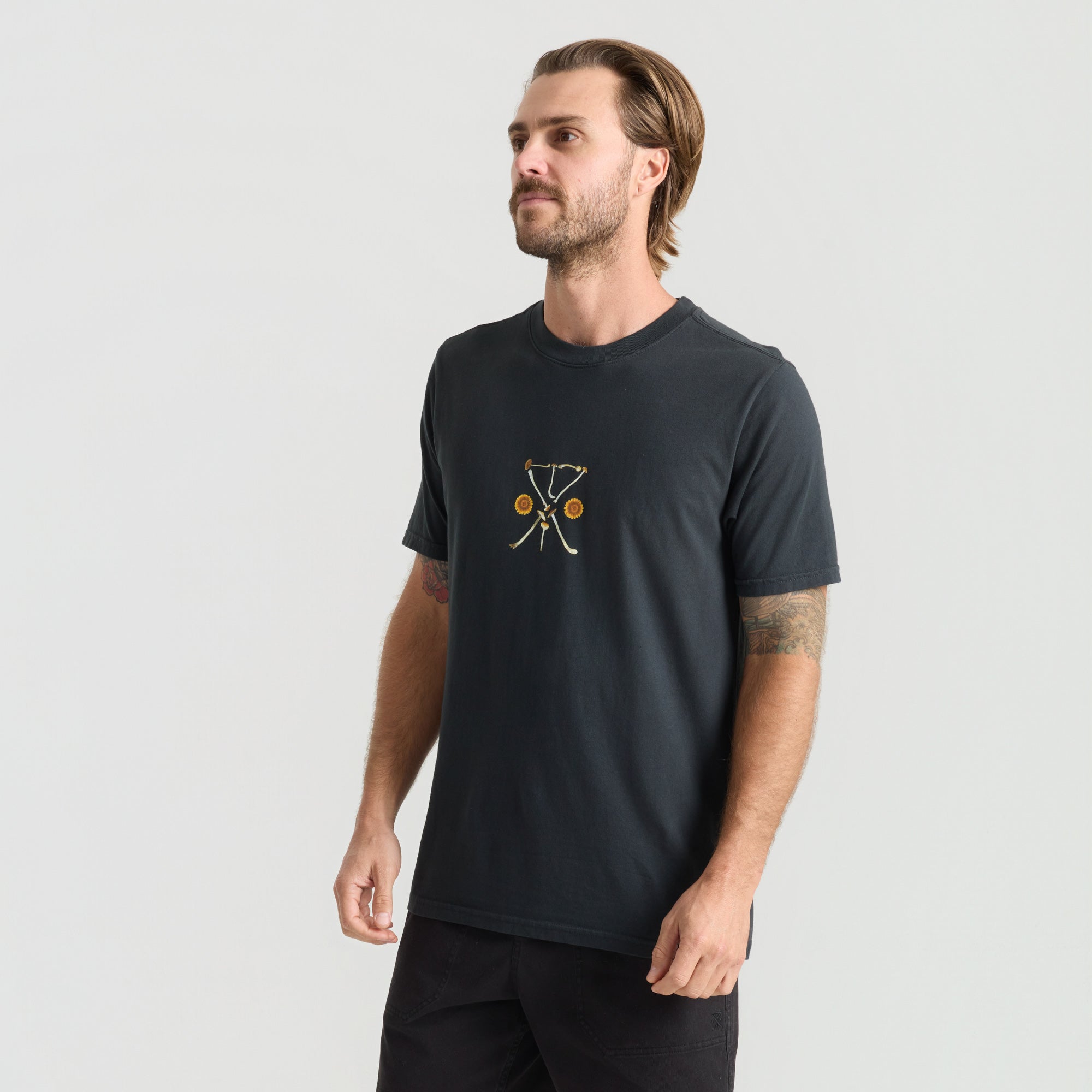 Active man wearing a Roark adventure-ready shirt in an outdoor setting, perfect for exploration and travel.