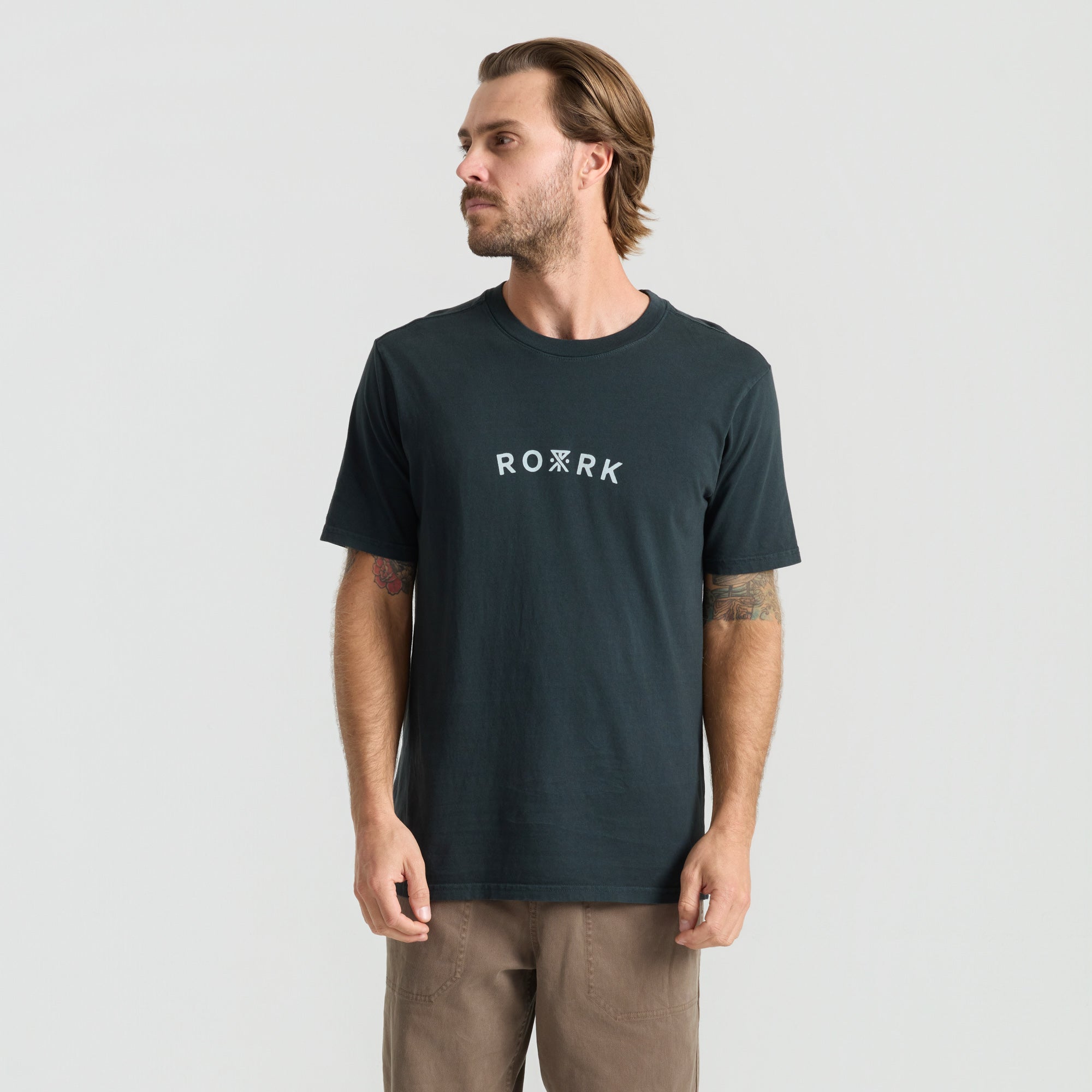 Active black shirt designed for adventure and outdoor activities, part of Roark's travel-inspired apparel collection.